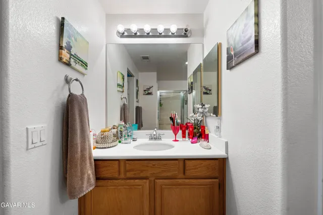 a bathroom with a sink and a mirror