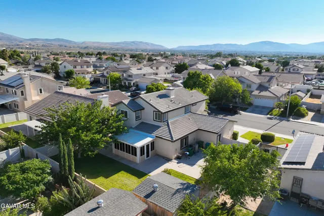 an aerial view of a house with a garden