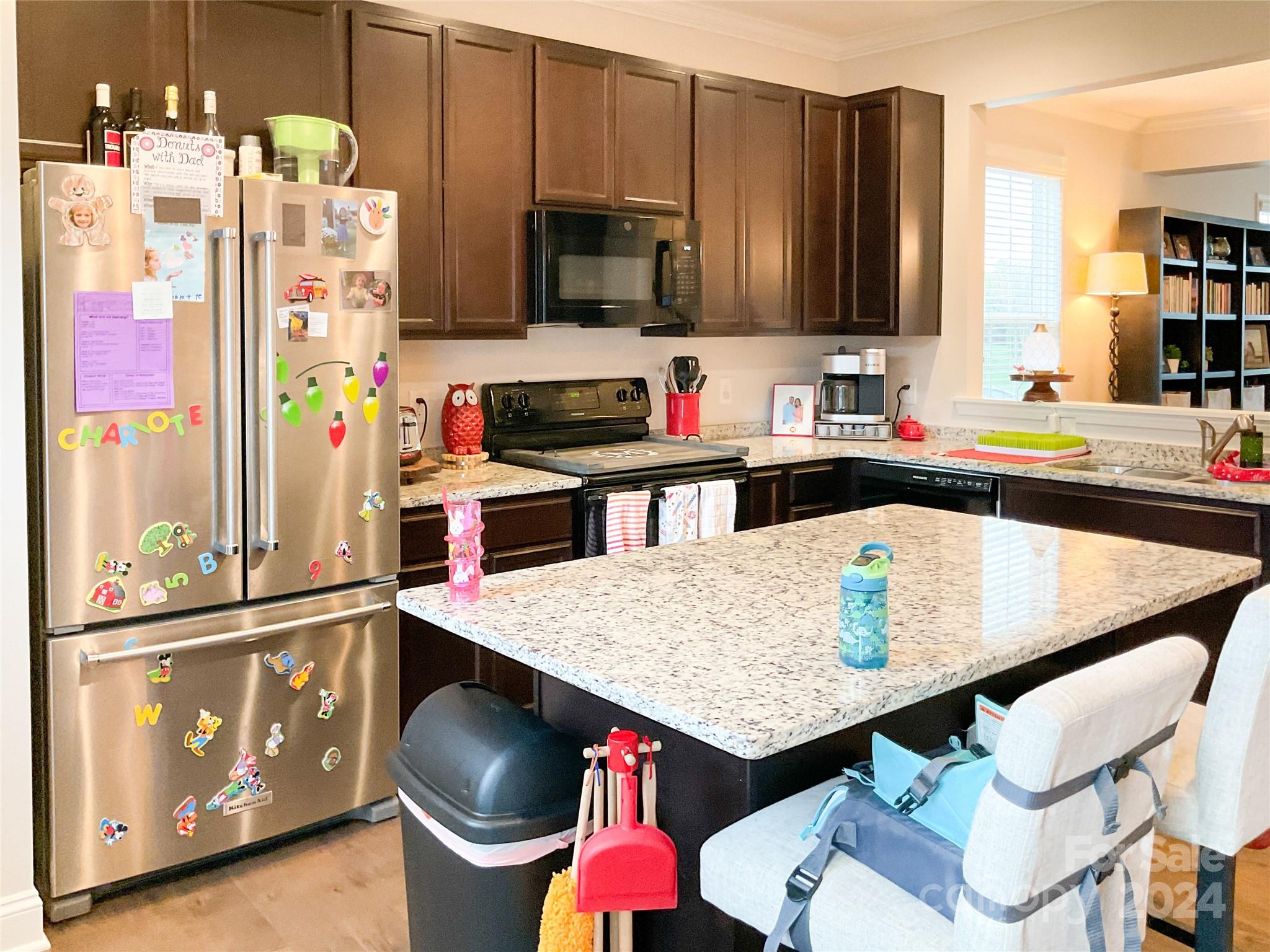 349 Intrepid Court Greer, SC 29650 - Photo 11 of 31 a kitchen with stainless steel appliances granite countertop a refrigerator a stove and a sink with wooden floor