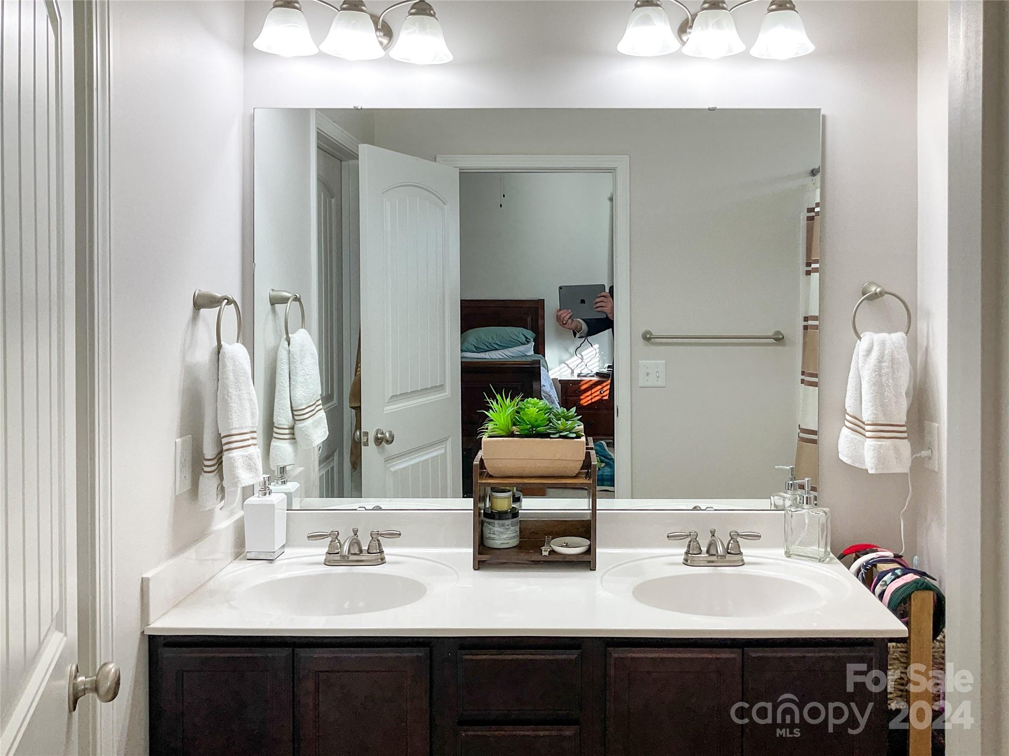 349 Intrepid Court Greer, SC 29650 - Photo 19 of 31 a en suite bathroom with a sink double vanity and a mirror