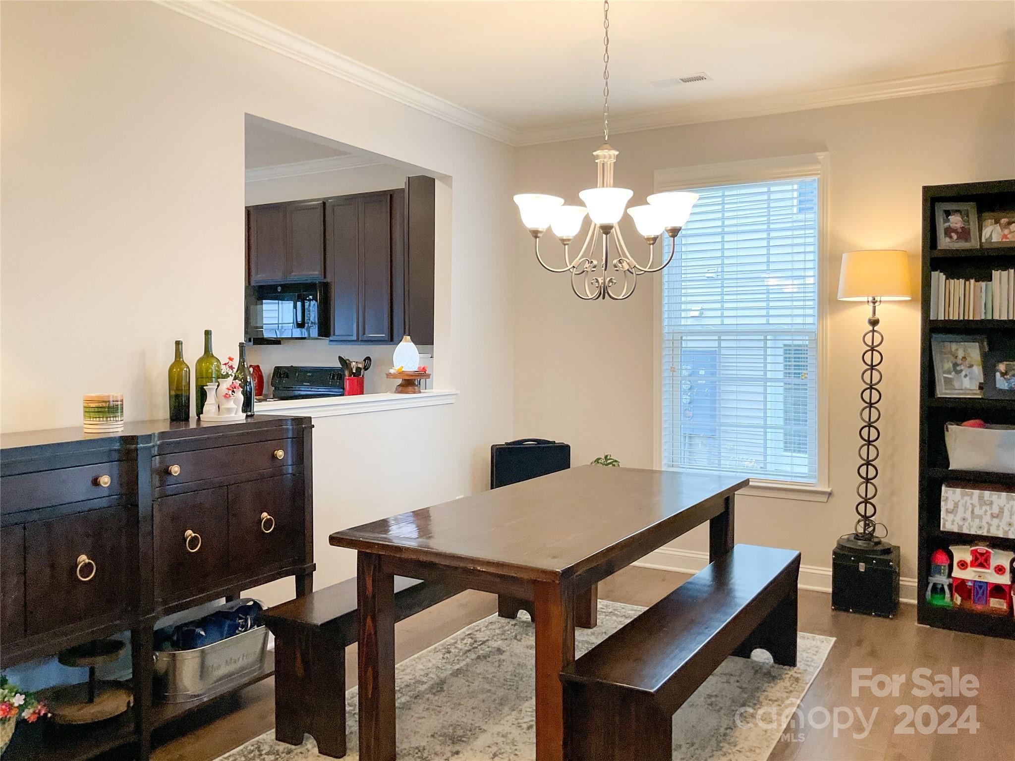 349 Intrepid Court Greer, SC 29650 - Photo 5 of 31 a view of a dining room with furniture and a chandelier fan