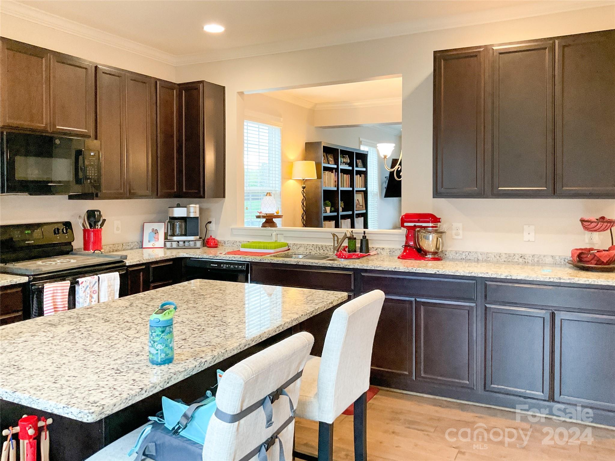 349 Intrepid Court Greer, SC 29650 - Photo 10 of 31 a kitchen with granite countertop a sink cabinets and window