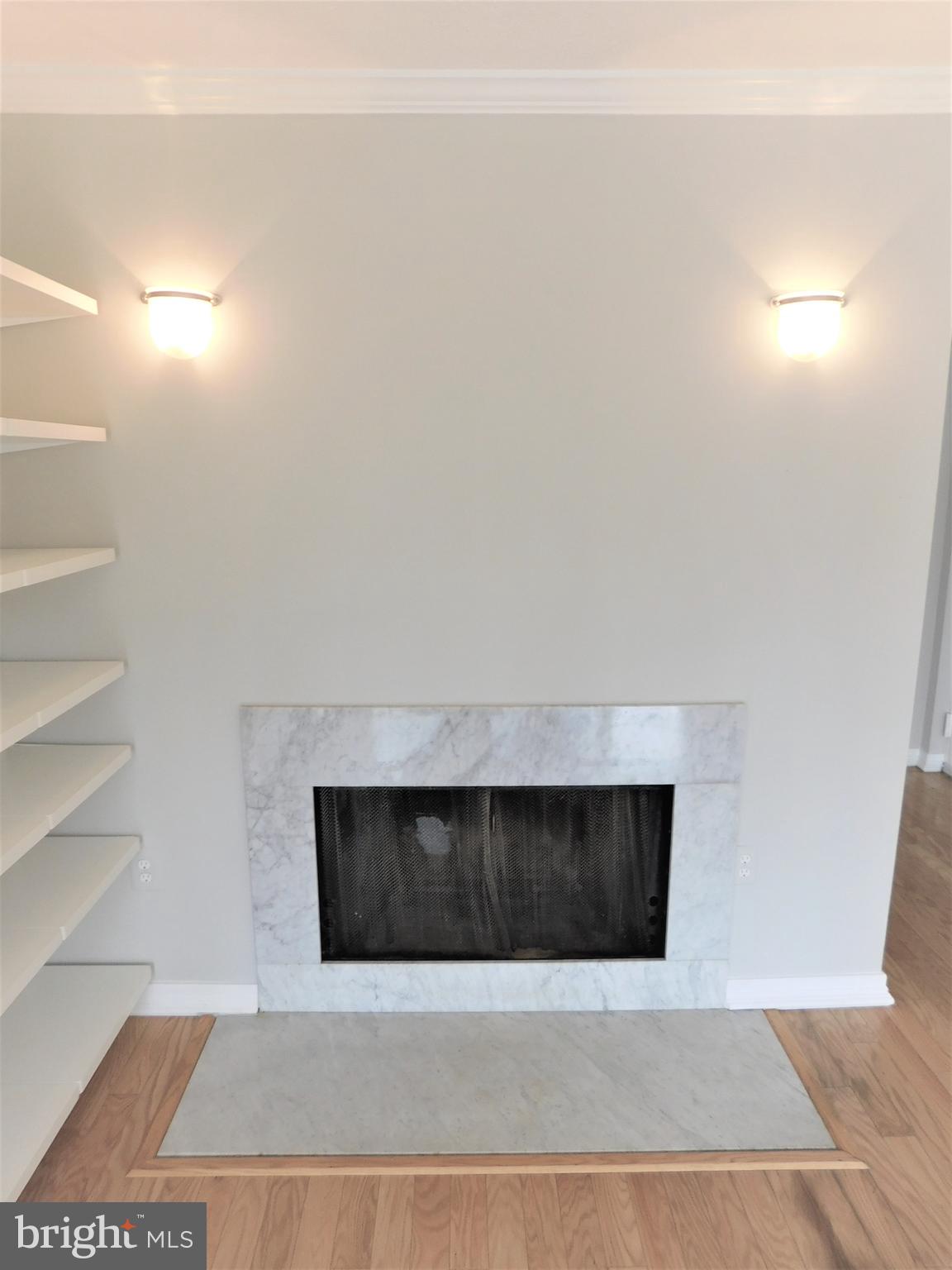 2214 Springwood Drive, Unit T4 Reston, VA 20191 - Photo 8 of 41 Wood Burning Fireplace/Sconces.