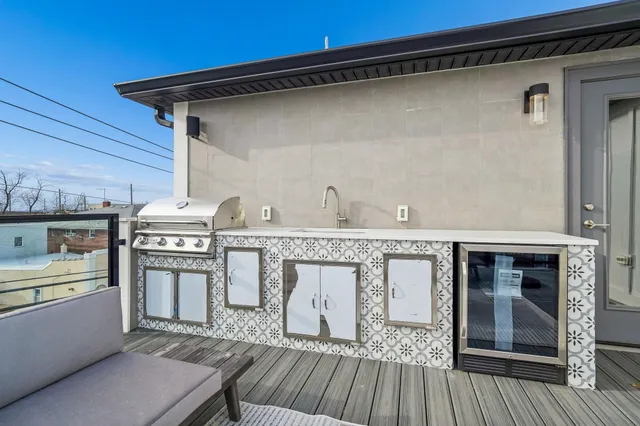 a view of staircase with railing and white walls