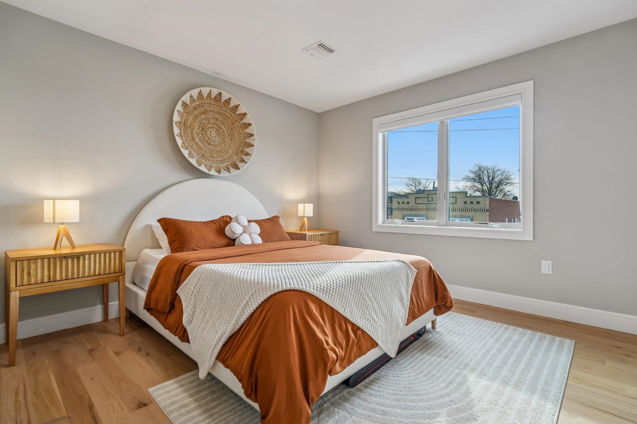 305 8th Street Fairview, NJ 07022 - Photo 14 of 27 a bedroom with a bed lamp and window