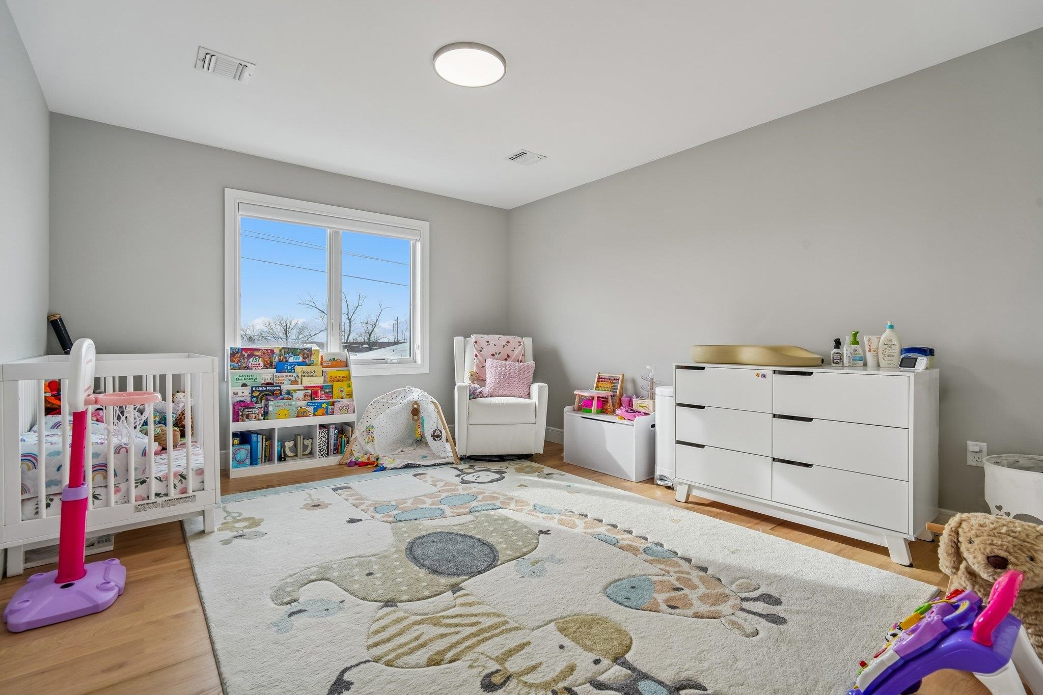 305 8th Street Fairview, NJ 07022 - Photo 15 of 27 a bedroom with a bed and closet