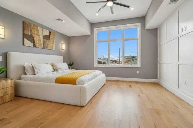 a spacious bedroom with a bed and a couch