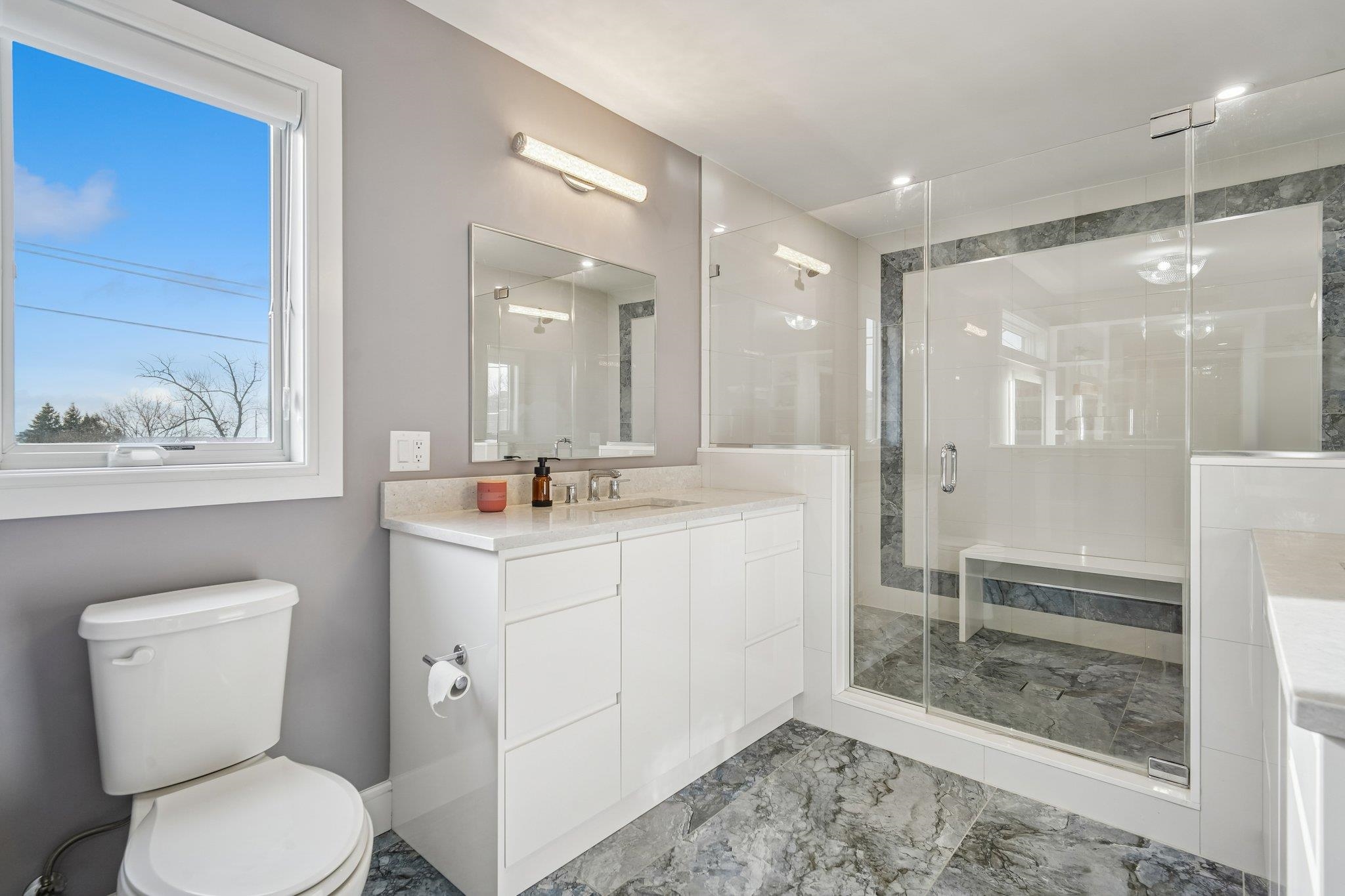 305 8th Street Fairview, NJ 07022 - Photo 19 of 27 a bathroom with a toilet sink and a mirror