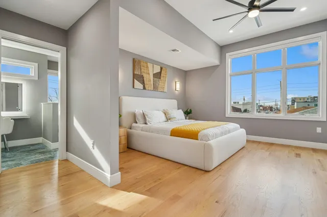 a bathroom with a sink double vanity and a shower