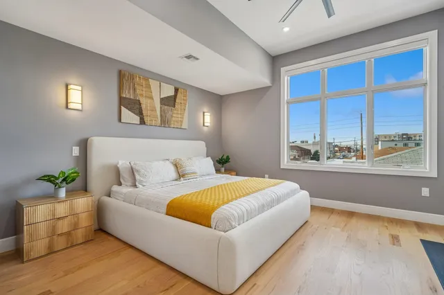 a bathroom with a toilet sink and a mirror