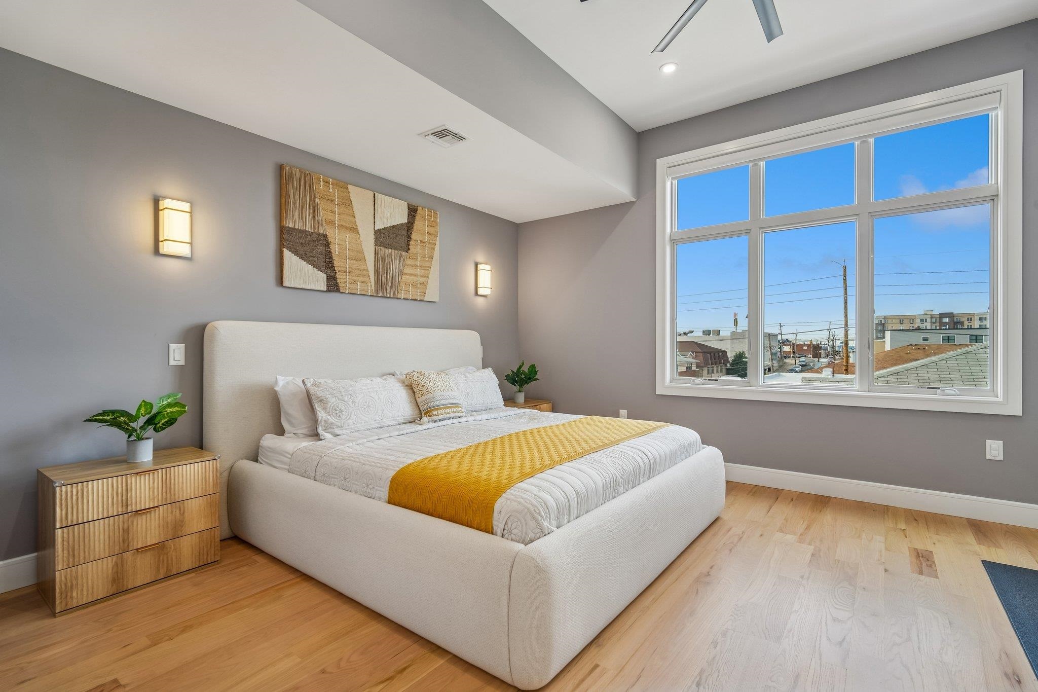 305 8th Street Fairview, NJ 07022 - Photo 22 of 27 a living room with a bed furniture and next to a window
