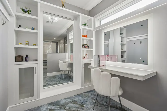 a roof deck with couches and potted plants with sky view