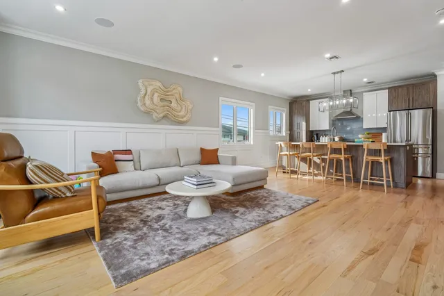 a living room with a fireplace a flat screen tv and a fireplace