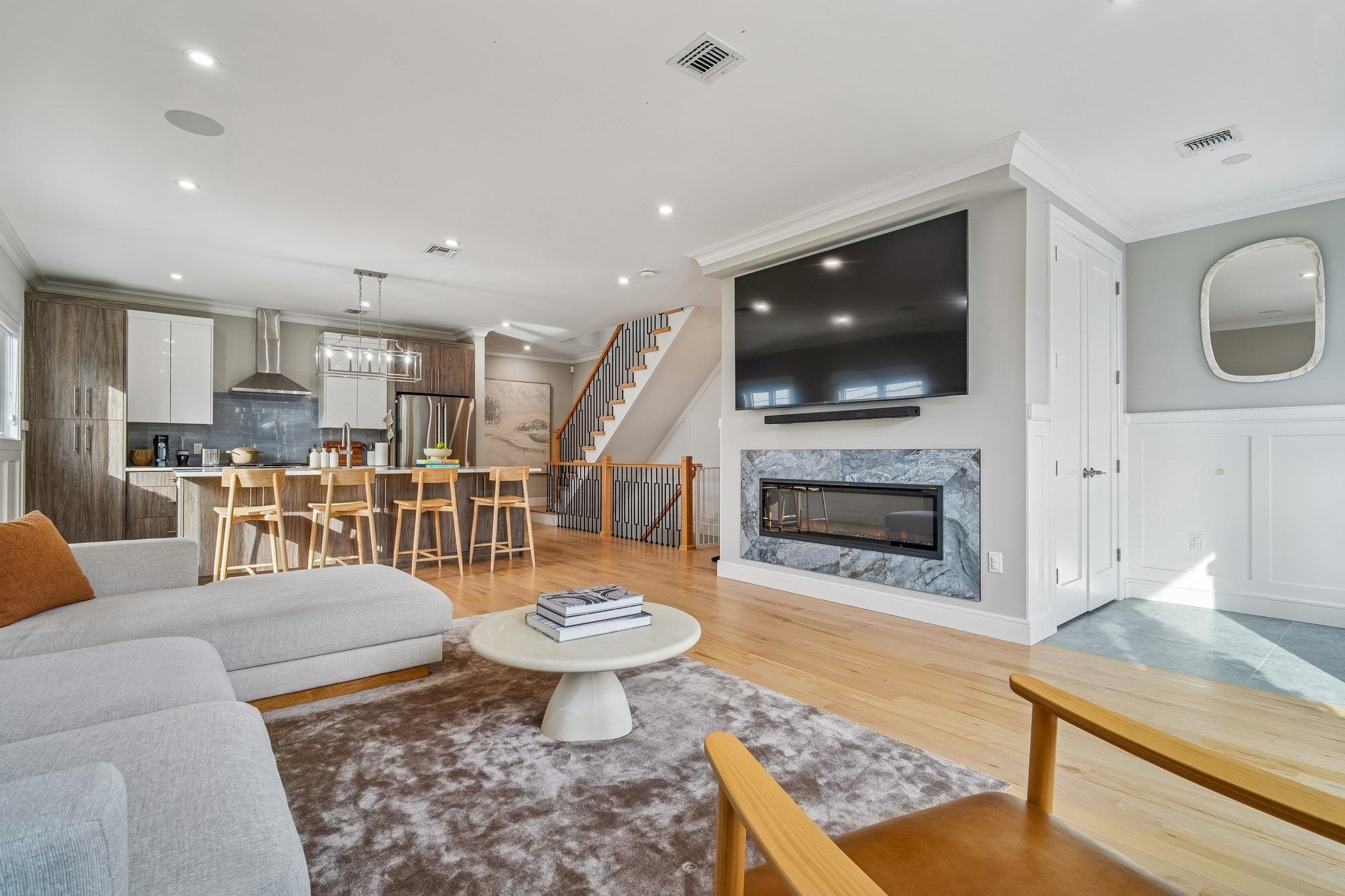 305 8th Street Fairview, NJ 07022 - Photo 5 of 27 a living room with furniture and a fireplace
