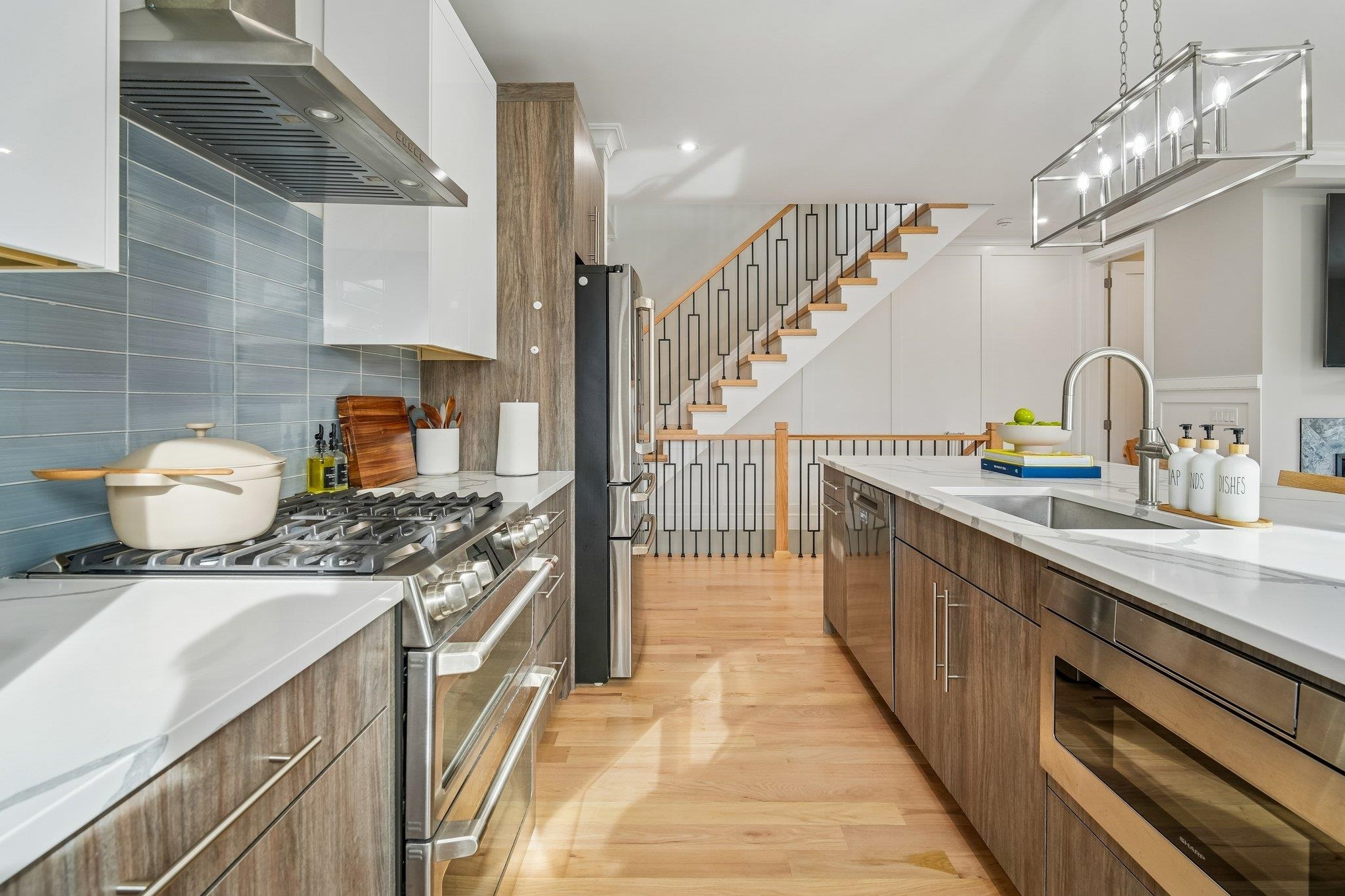 305 8th Street Fairview, NJ 07022 - Photo 6 of 27 a kitchen with a sink and cabinets