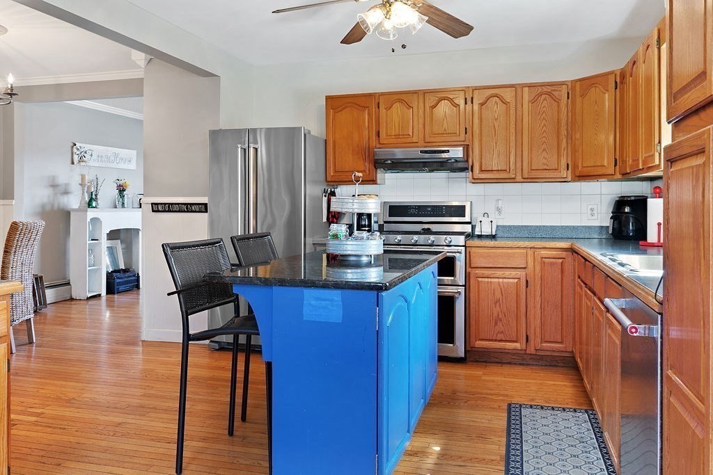524 Merrimack Street Methuen, MA 01844 - Photo 11 of 34 a kitchen with stainless steel appliances granite countertop a stove top oven a sink dishwasher and a refrigerator