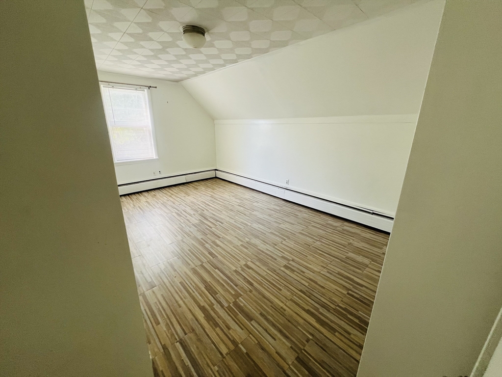 524 Merrimack Street Methuen, MA 01844 - Photo 19 of 34 a view of empty room with wooden floor