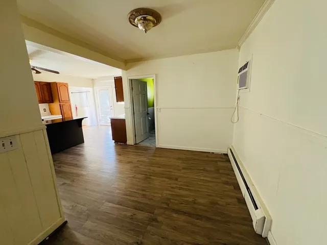a view of a livingroom with wooden floor