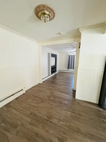 a view of a livingroom with wooden floor