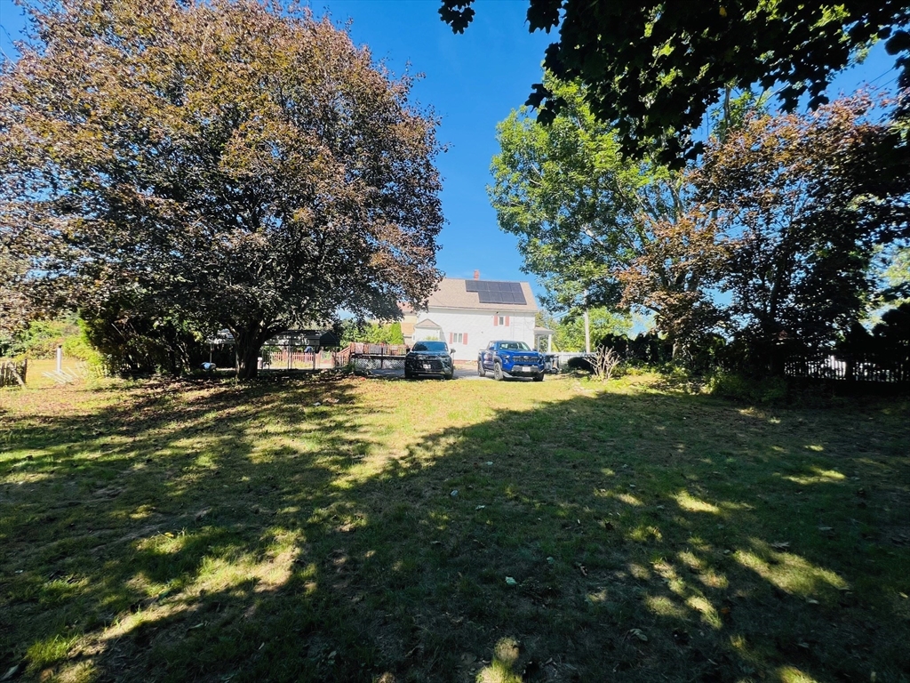 524 Merrimack Street Methuen, MA 01844 - Photo 4 of 34 a view of road with large trees