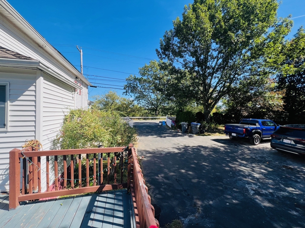 524 Merrimack Street Methuen, MA 01844 - Photo 7 of 34 a view of backyard with a car parked on the road