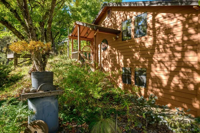 a view of a livingroom with furniture window and wooden floor