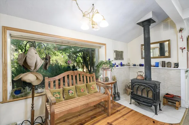a dining room with a wooden table and chairs
