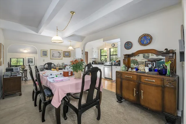 a kitchen with a white cabinets and window