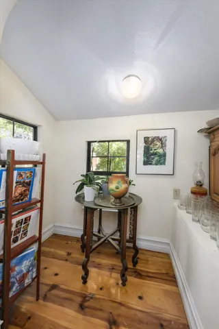 a kitchen with sink refrigerator and cabinets