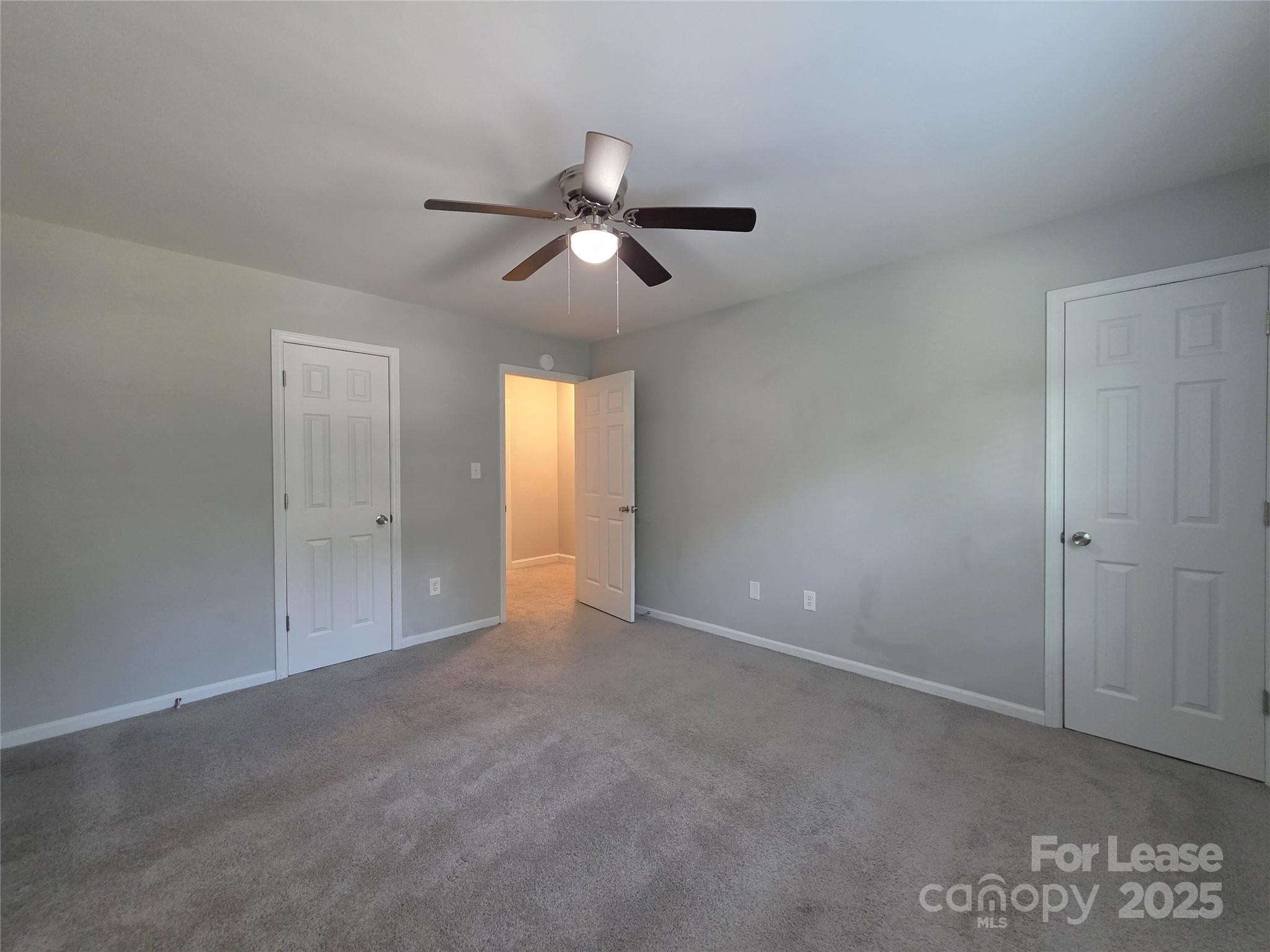 403 Spring Street Northwest Concord, NC 28025 - Photo 15 of 17 a view of an empty room and a ceiling fan