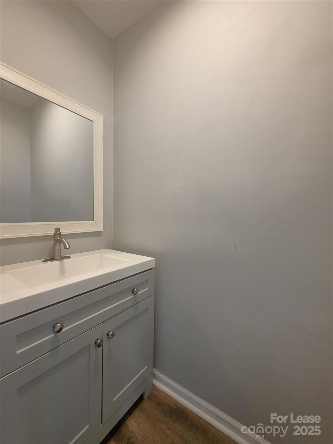 403 Spring Street Northwest Concord, NC 28025 - Photo 8 of 17 a bathroom with a sink and vanity