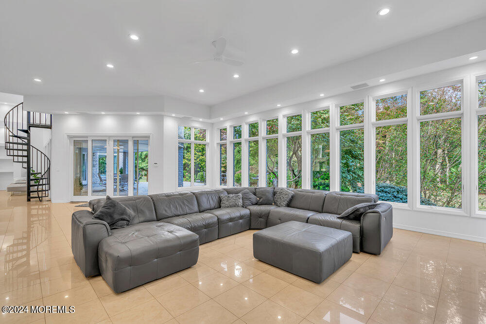 27 Revolutionary Road Colts Neck, NJ 07722 - Photo 19 of 77 a living room with furniture and large windows