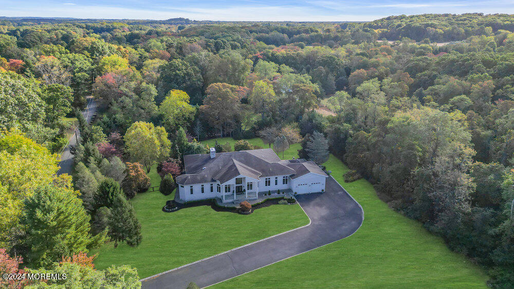 27 Revolutionary Road Colts Neck, NJ 07722 - Photo 76 of 77 an aerial view of a house with big yard