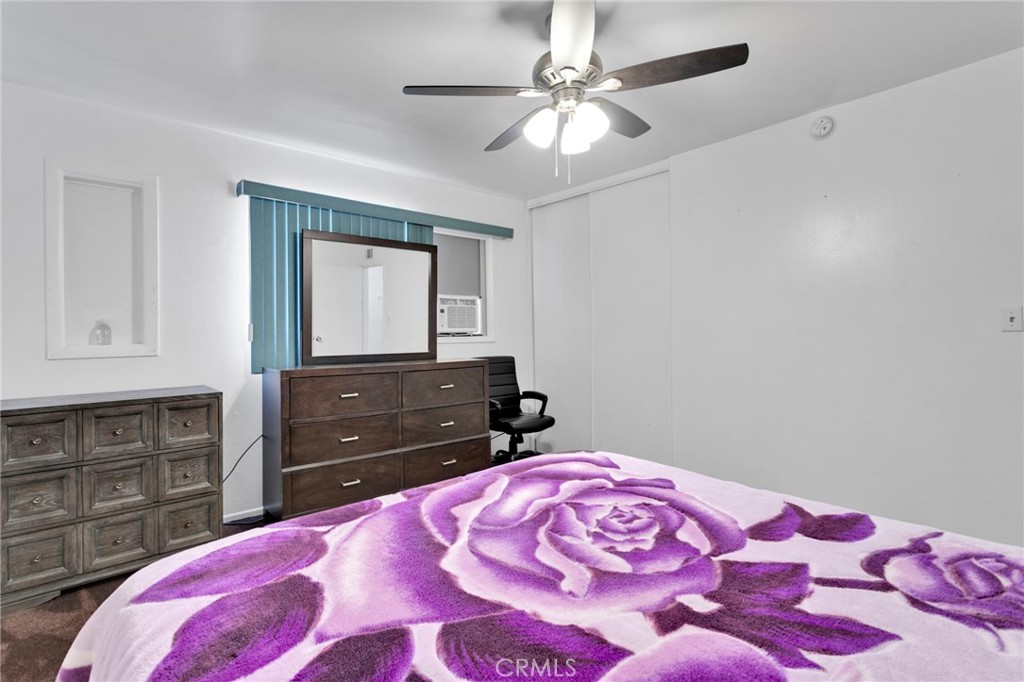 7925 Spohn Avenue Fontana, CA 92336 - Photo 15 of 25 a bedroom with a bed and a dresser