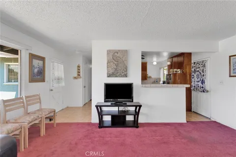 a view of living room with furniture and flat screen tv