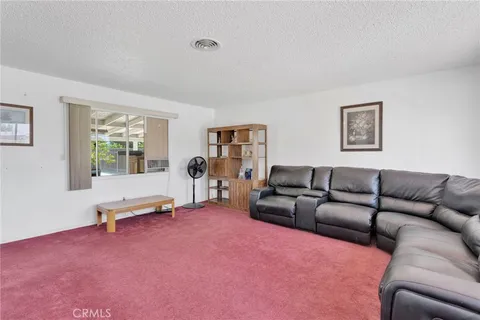 a living room with furniture window and wooden floor