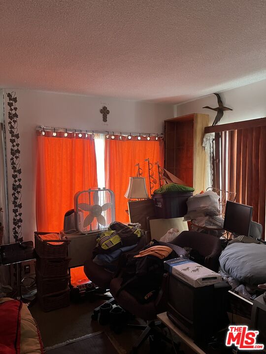 4431 Don Ricardo Drive, Unit 10 Los Angeles, CA 90008 - Photo 4 of 11 a living room with furniture and a large window