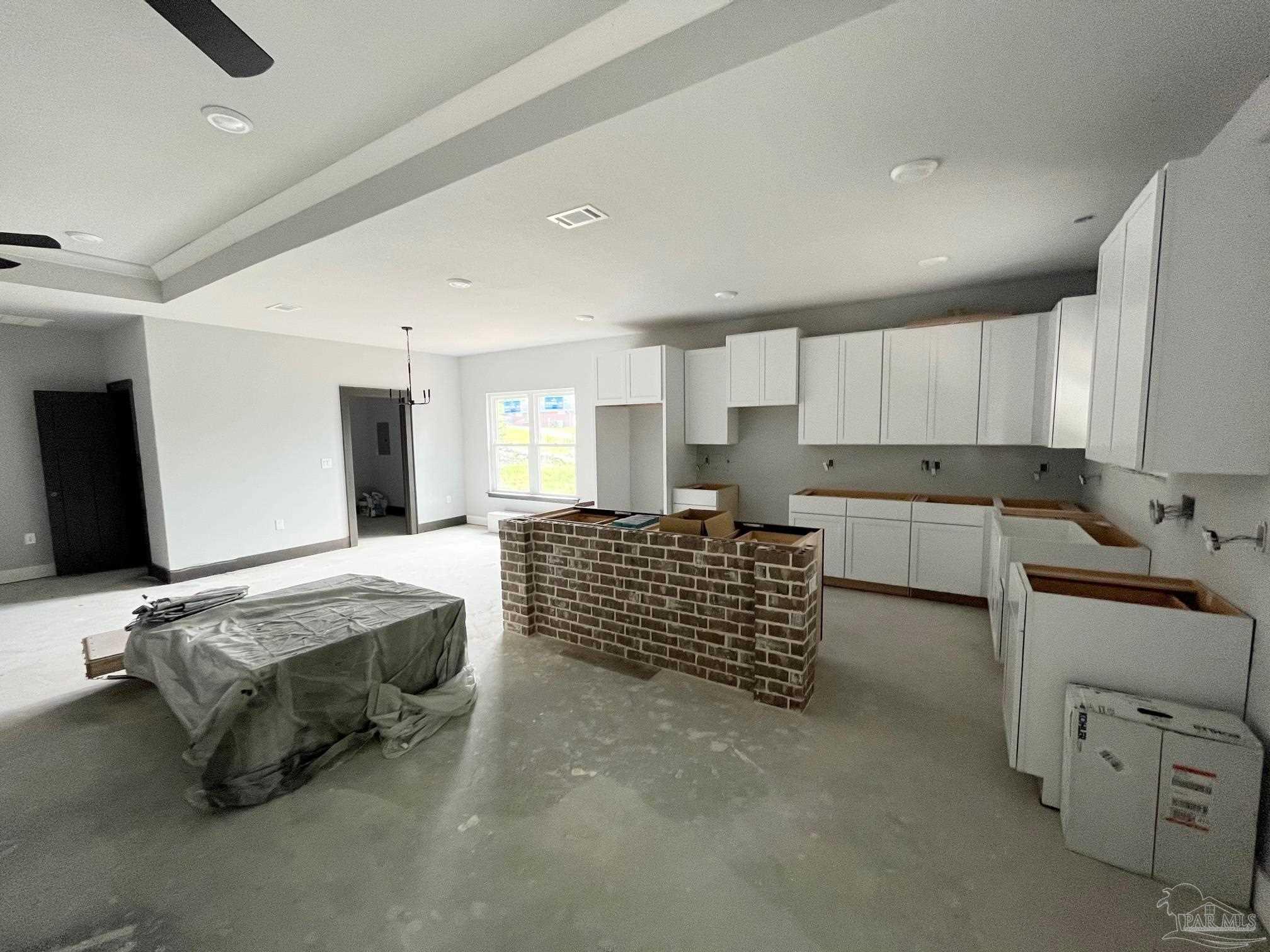 4991 Timber Ridge Drive Milton, FL 32571 - Photo 4 of 25 a large kitchen with kitchen island granite countertop a sink and counter space