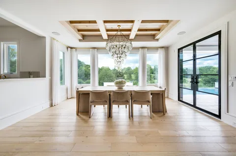 a kitchen with stainless steel appliances cabinets and a window