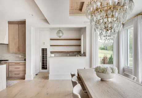 a bedroom with furniture and a large window