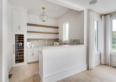 a living room with furniture and a lamp