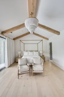 a bathroom with a double vanity sink mirror and shower
