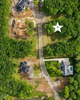a living room with fireplace furniture and a large window