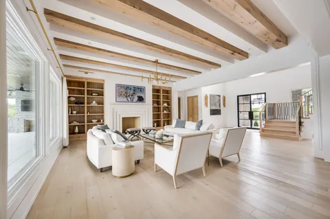 a living room with furniture and white walls