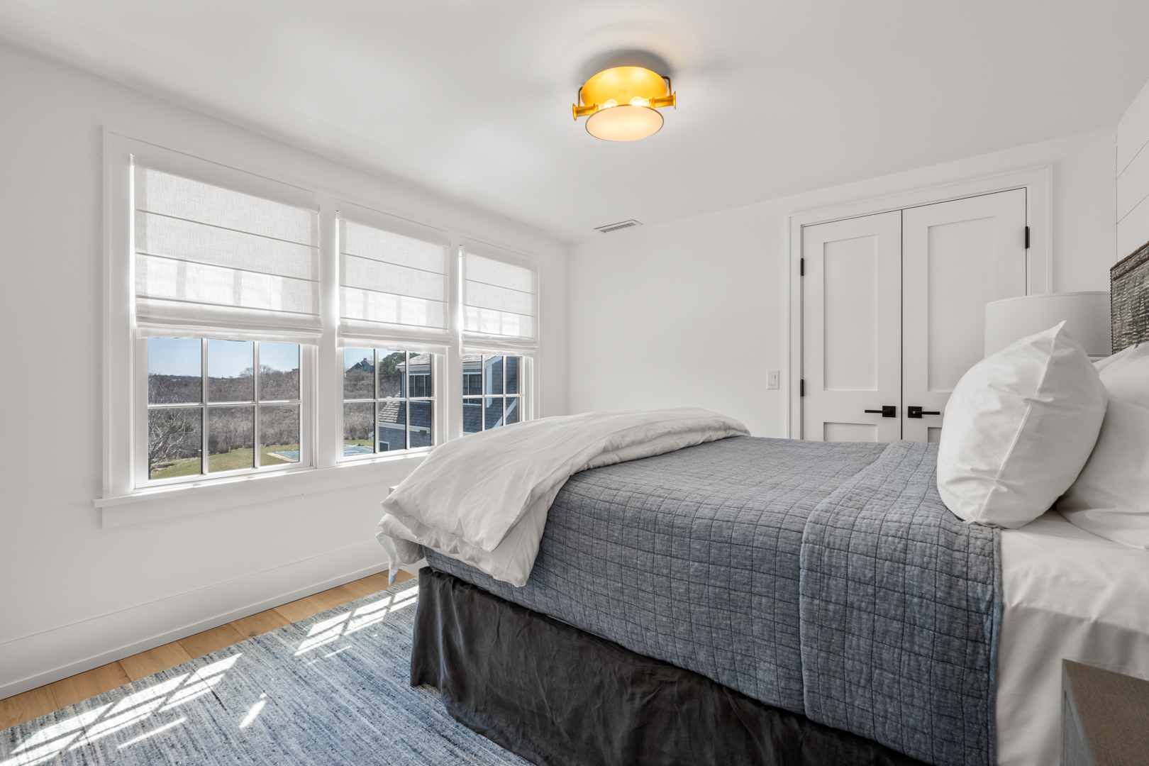 174 Cliff Road Nantucket, MA 02554 - Photo 29 of 49 a bedroom with a bed and a window