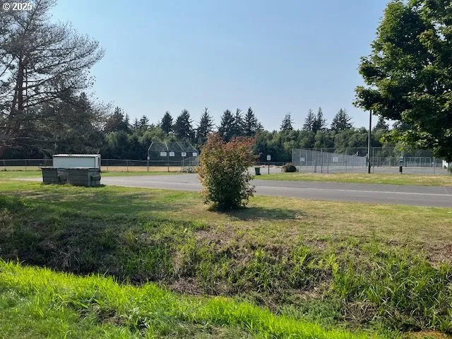 a swimming pool with an outdoor space and seating area
