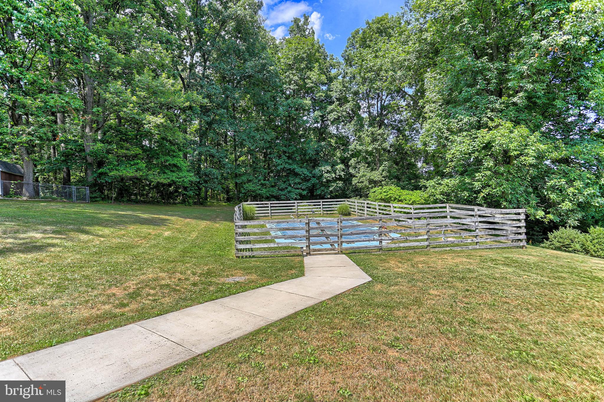 7939 Hickory Road Stewartstown, PA 17363 - Photo 36 of 49 Pathway from deck to pool area