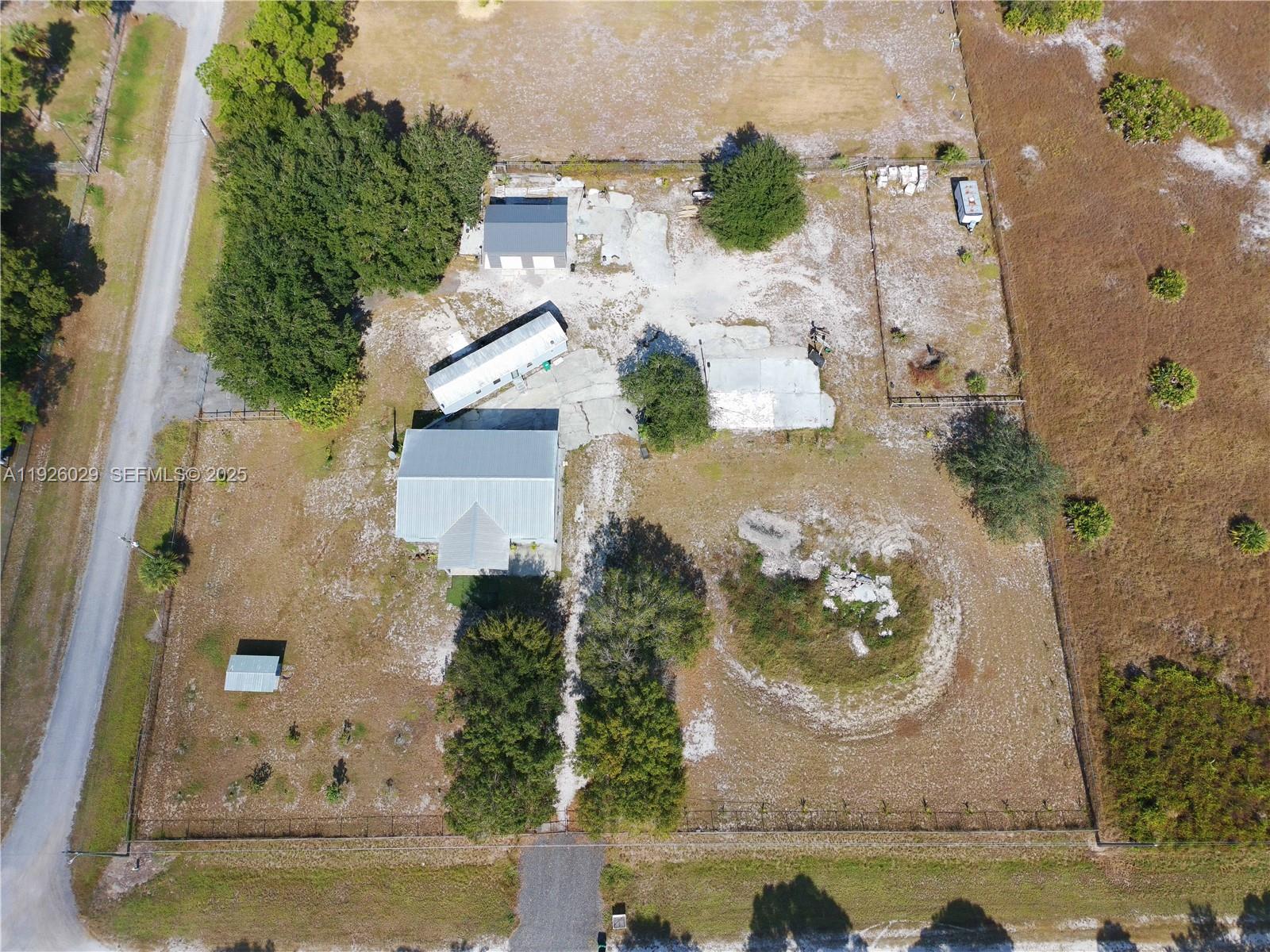 527 Perimeter Road Clewiston, FL 33440 - Photo 2 of 40 an aerial view of a residential houses with outdoor space