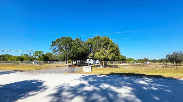 a view of a lake with houses in the background