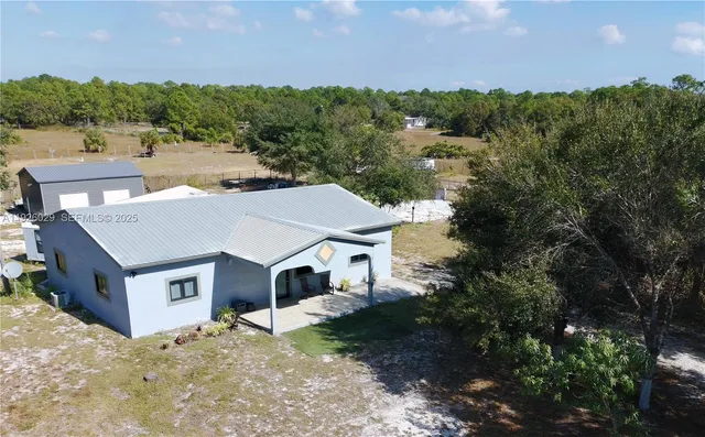 a aerial view of a house with a yard